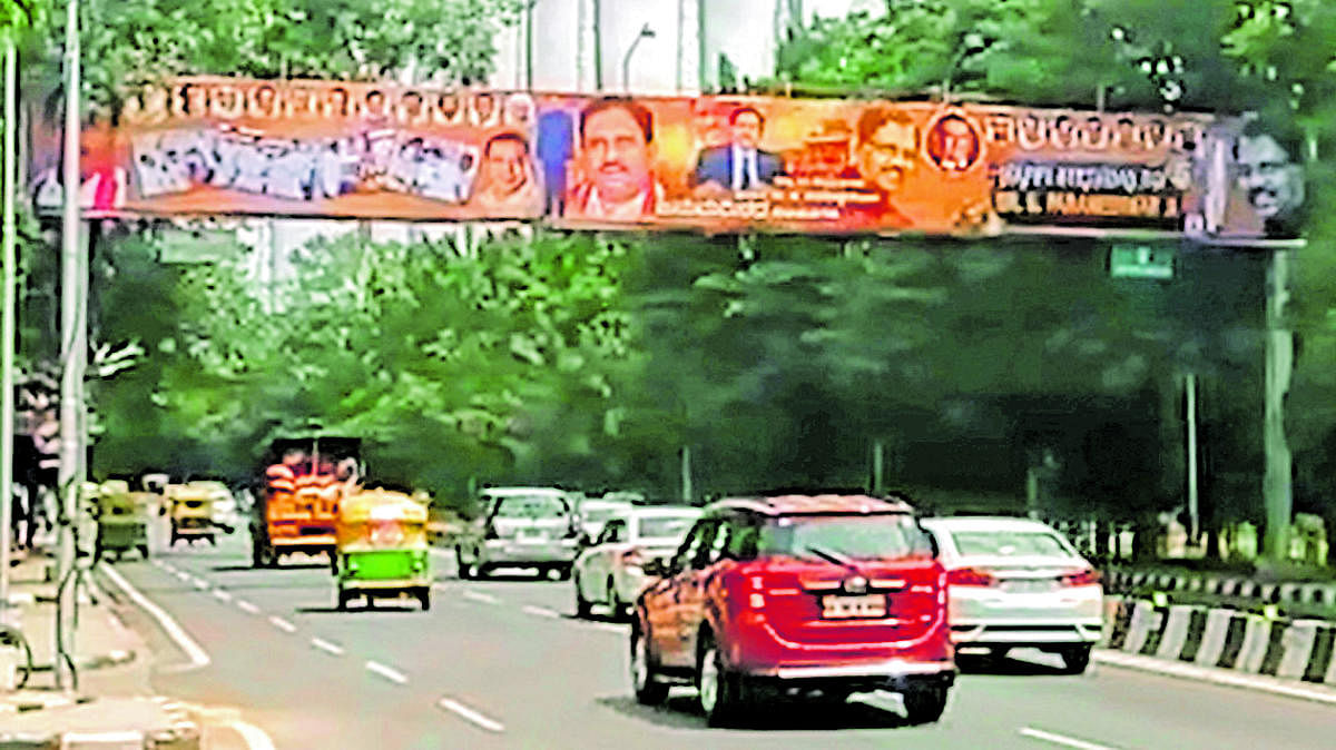 Banners wishing G Parameshwara, on T Chowdaiah Road near Golf Club, which were removed on Sunday evening. TV grab