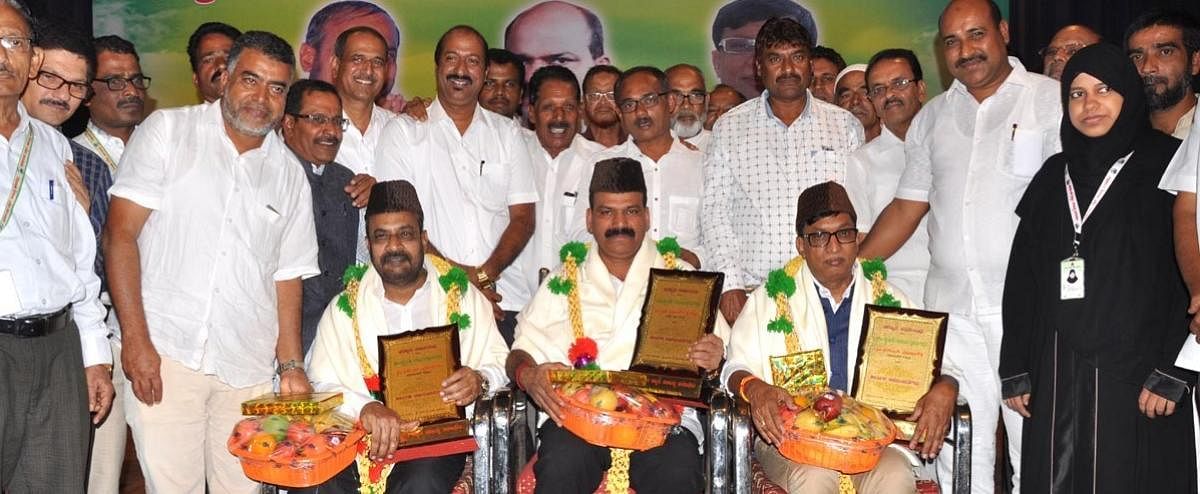 Legislators S L Dharme Gowda, S L Boje Gowda and T D Raje Gowda were felicitated during Beary Cultural Programme in Chikkamagaluru on Monday. Karnataka Beary Sahitya Academy Chairman Muhammed Karambaru looks on.