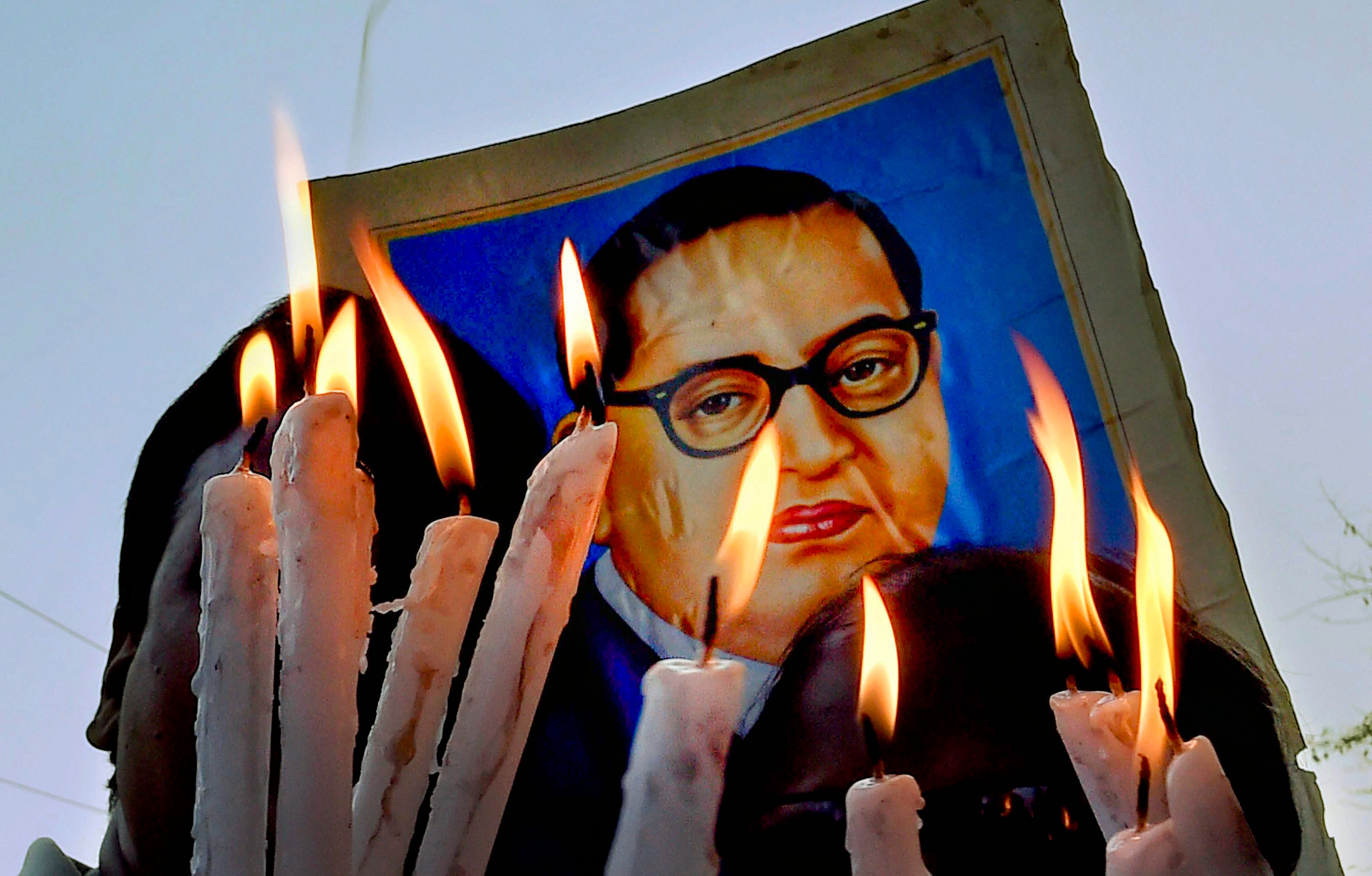 Dalit activists participate in a candlelight vigil to protest against Supreme Court's ruling on SC/ST Act, in Kolkata. PTI/Ashok Bhaumik