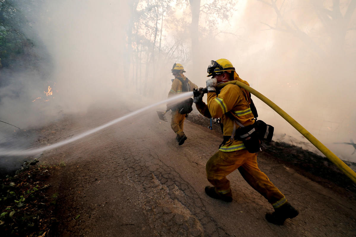 A firefighter knocks down hotspots to slow the spread of the River Fire (Mendocino Complex) in Lakeport, California, U.S. July 31, 2018. (REUTERS/Fred Greaves/File Photo)
