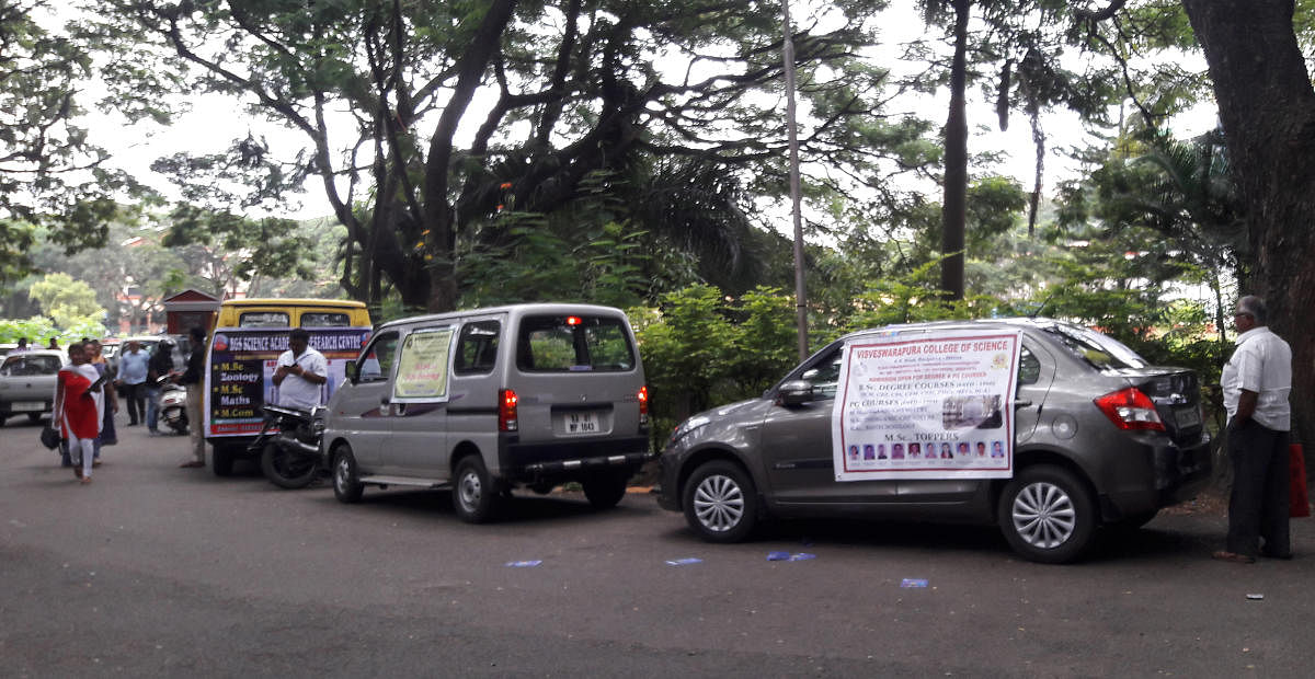 The vehicles of private colleges on the Central College campus on Monday. 