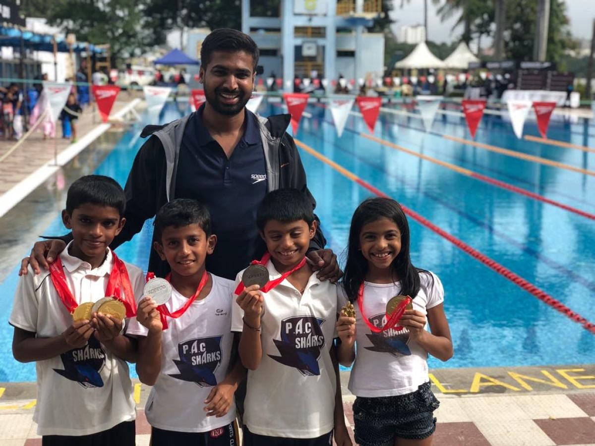 Puttur Aquatic Club swimmers Diganth V S, Amanraj, Anvith Rai Barike and Siya Bhavin Savjani proudly display their medals won at the SPEEDO Invitational Swimming Championship 2018 held in Bengaluru recently.