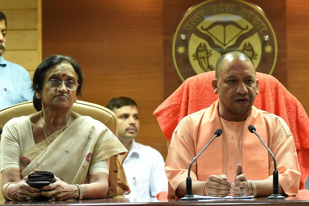 UP Chief Minister Yogi Adityanath and Women and Child Welfare Minister Rita Bahuguna Joshi address a press conference to recommend CBI probe into the Deoria shelter home case, in Lucknow on Tuesday. PTI