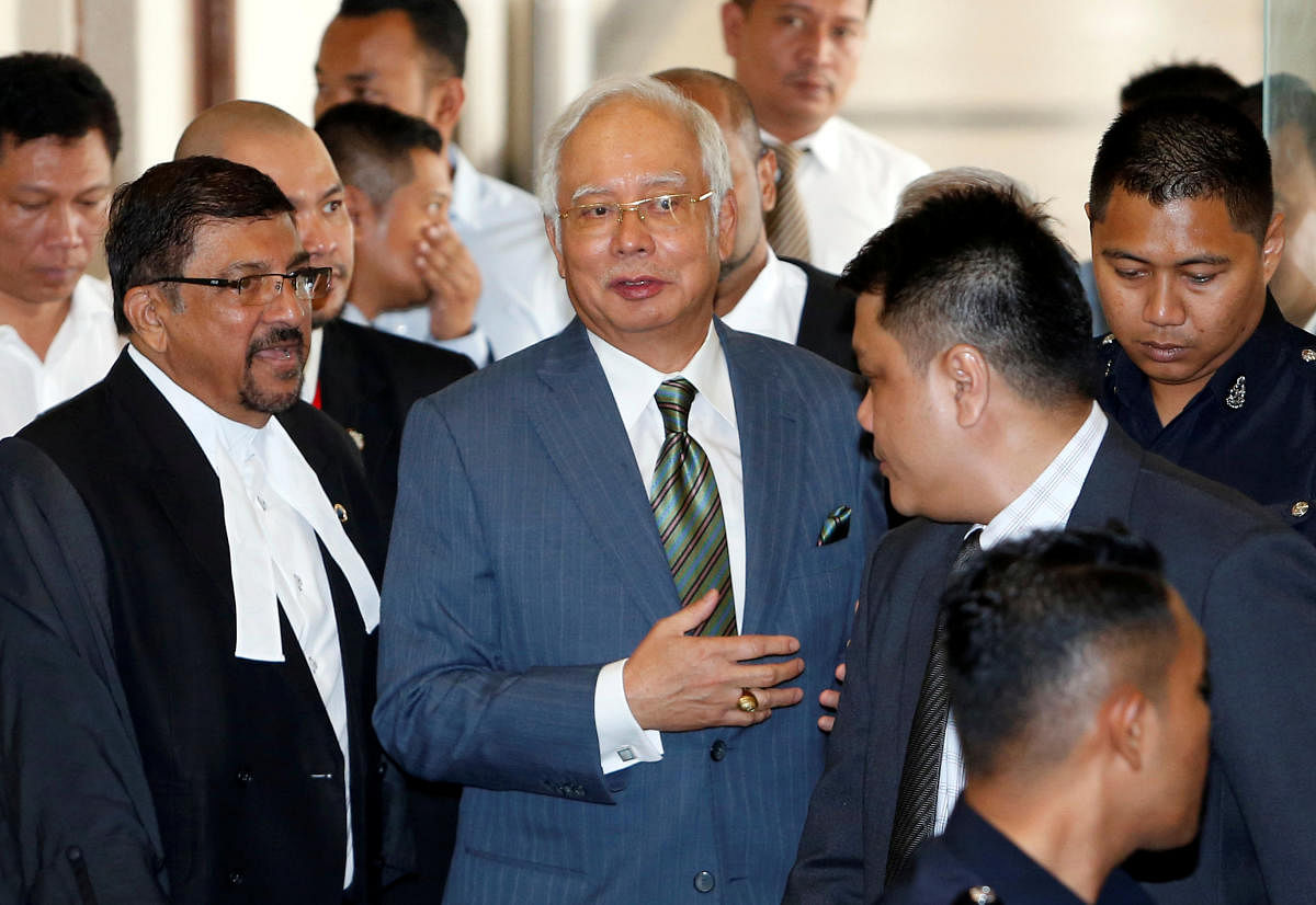 Malaysia's former prime minister Najib Razak walks out of a courtroom in Kuala Lumpur, Malaysia August 8, 2018. (REUTERS/Lai Seng Sin)