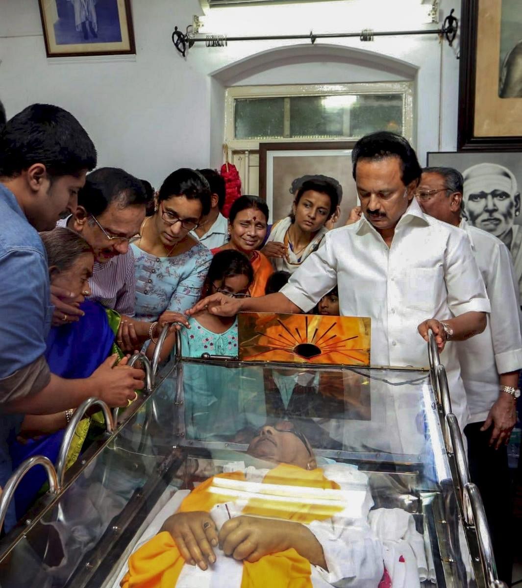 Chennai: DMK leader MK Stalin stands alongside the mortal remains of his father and DMK chief M Karunanidhi, in Chennai on Wednesday, Aug. 08, 2018. Karunanidhi died yesterday after a prolonged illness, in the city hospital where the leader was admitted.