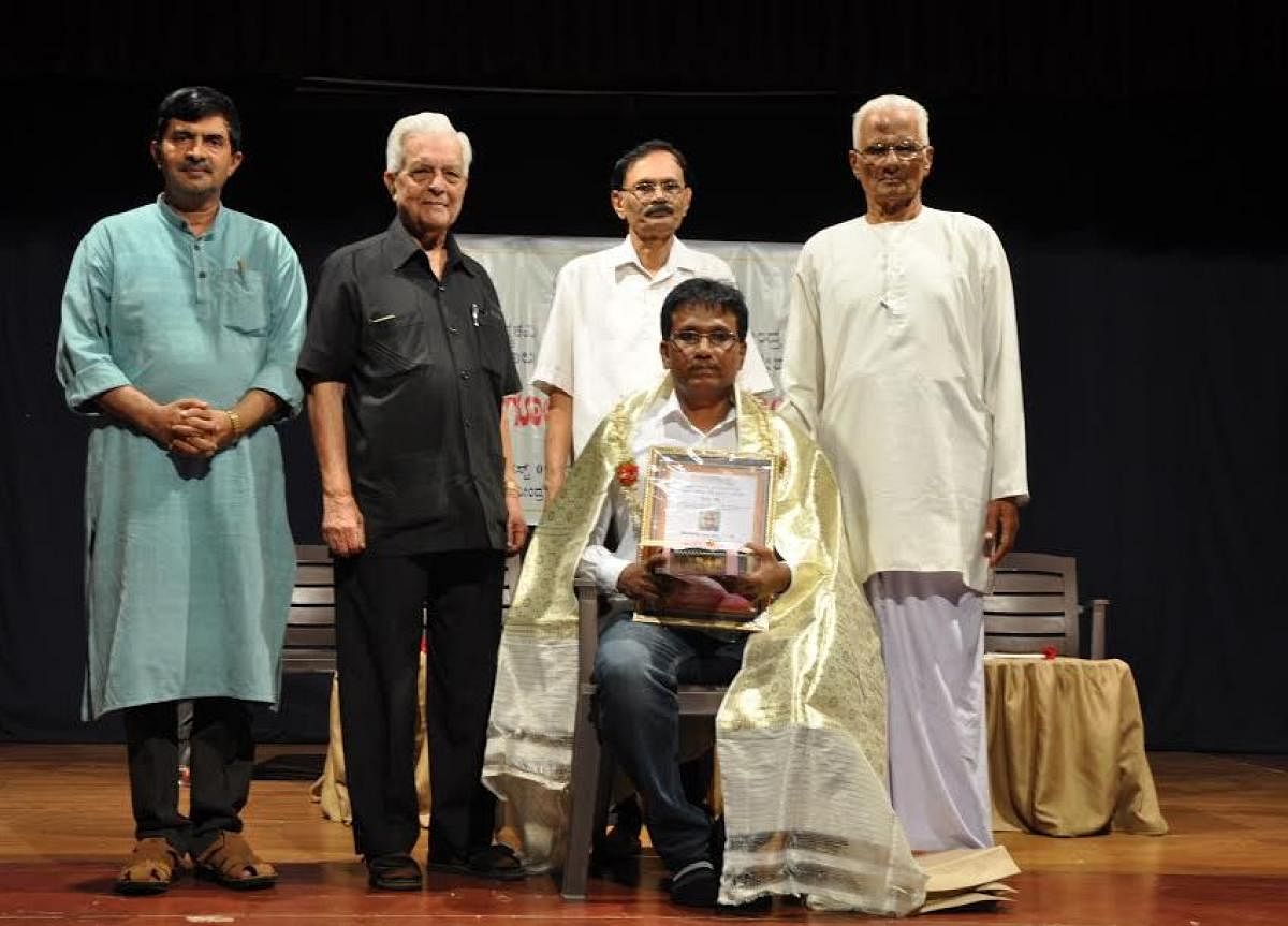The Kadengodlu Kavya Prashasti offered by the Rashtrakavi Govind Pai Research Centre in Udupi and MAHE was presented to poet K P Nataraj in Udupi on Thursday. Writer Erya Lakshminarayana Alva is present.