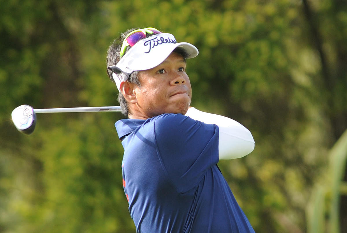 Thammanoon Sriroj of Thailand in action on the first day of the TAKE Solutions Masters Golf tournament at the KGA course on Thursday. DH Photo/ Srikanta Sharma R