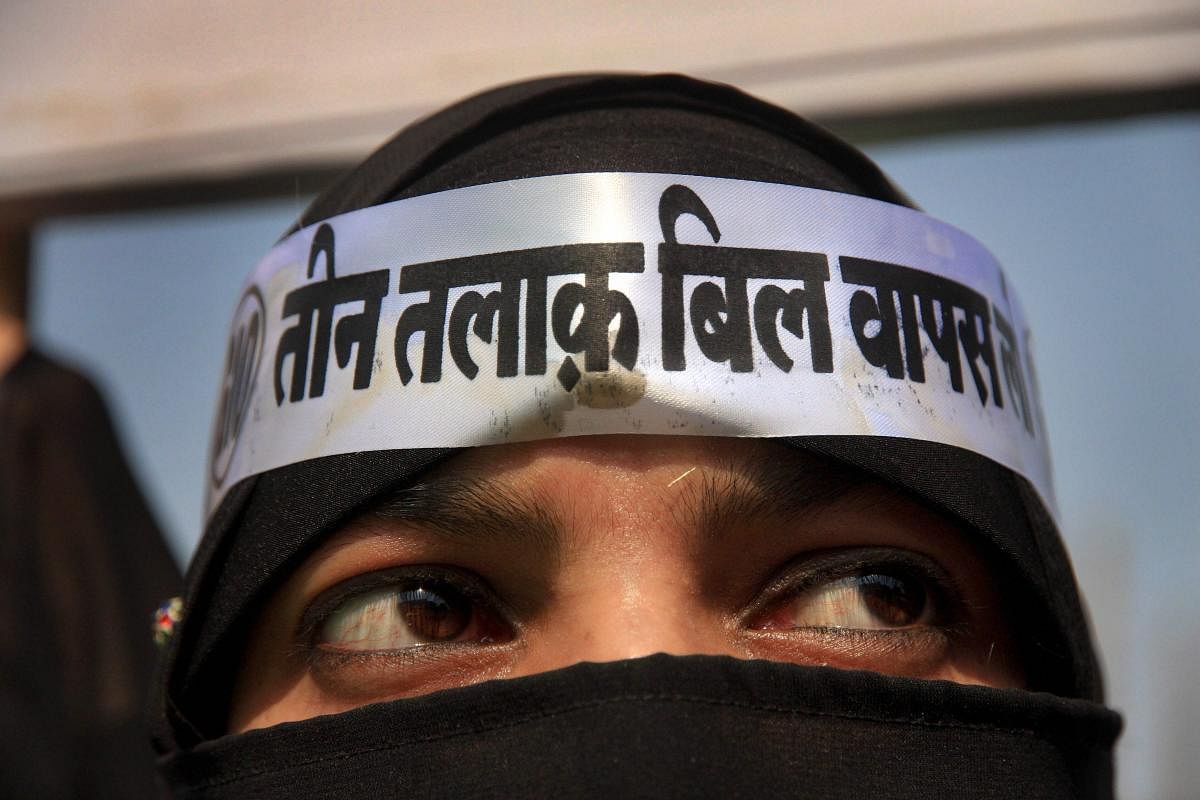 A burqa-clad woman looks on during a protest against the proposed Triple Talaq bill in Mumbra near Mumbai. (PTI File Photo)