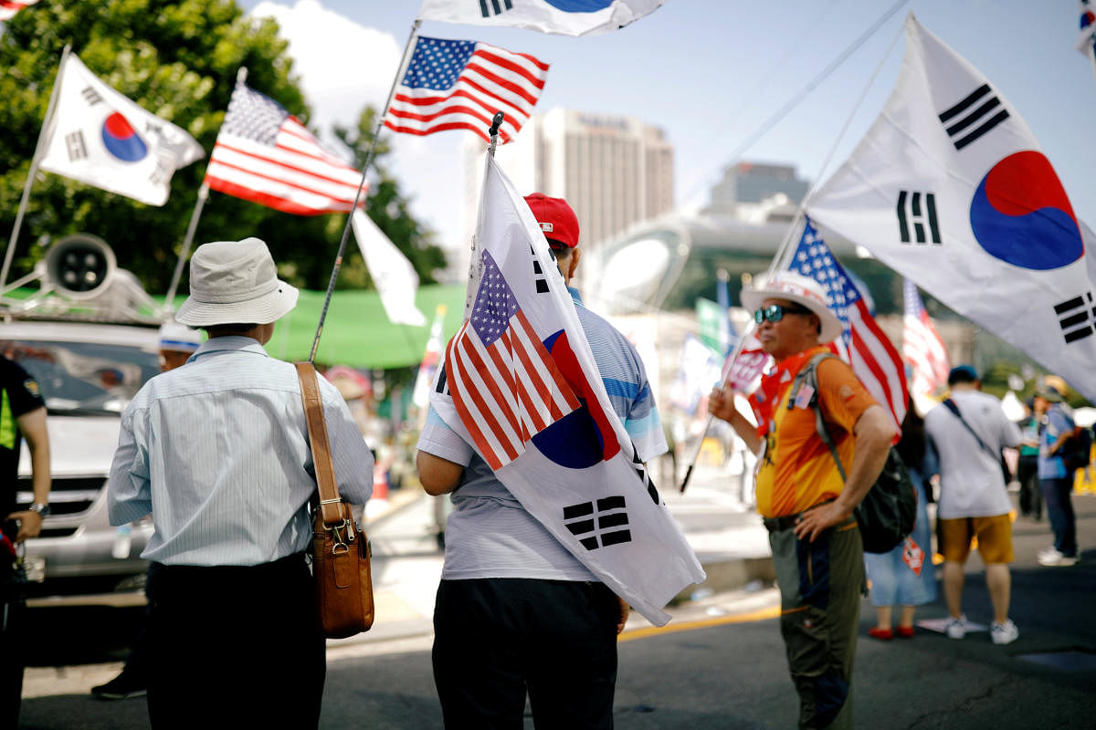Members of a conservative right-wing civic group attend an anti-North Korea and pro-U.S. protest in Seoul, South Korea, August 4, 2018. Picture taken on August 4, 2018. REUTERS/Kim Hong-Ji