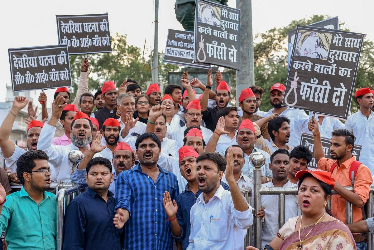 Allahabad: Samajwadi Party activists display placards and raise slogans against Uttar Pradesh Chief Minister Yogi Adityanath during a protest over the recent Deoria shelter home incident, in Allahabad on Tuesday, Aug 7, 2018. (PTI Photo) (PTI8_7_2018_0002