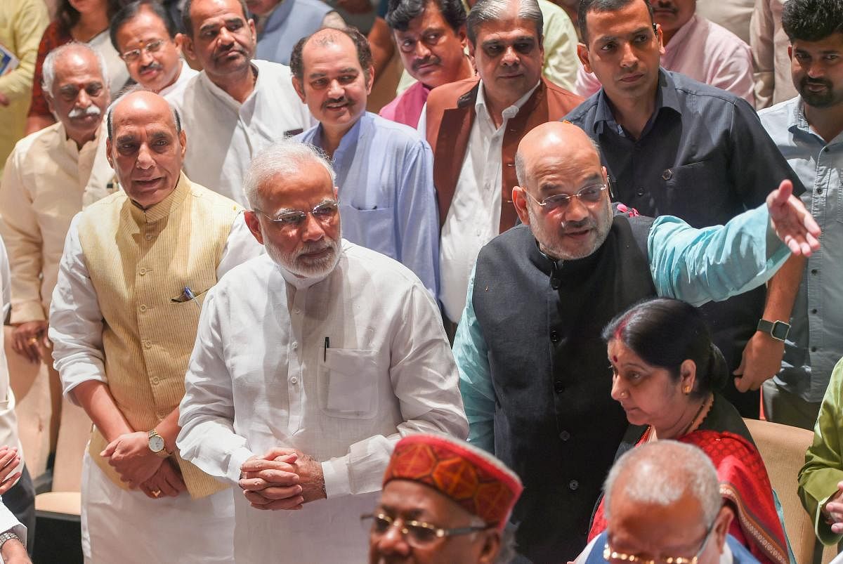 Prime Minister Narendra Modi, party president Amit Shah and Rajnath Singh during BJP Parliamentary Party meeting at Parliament House, in New Delhi. PTI file photo