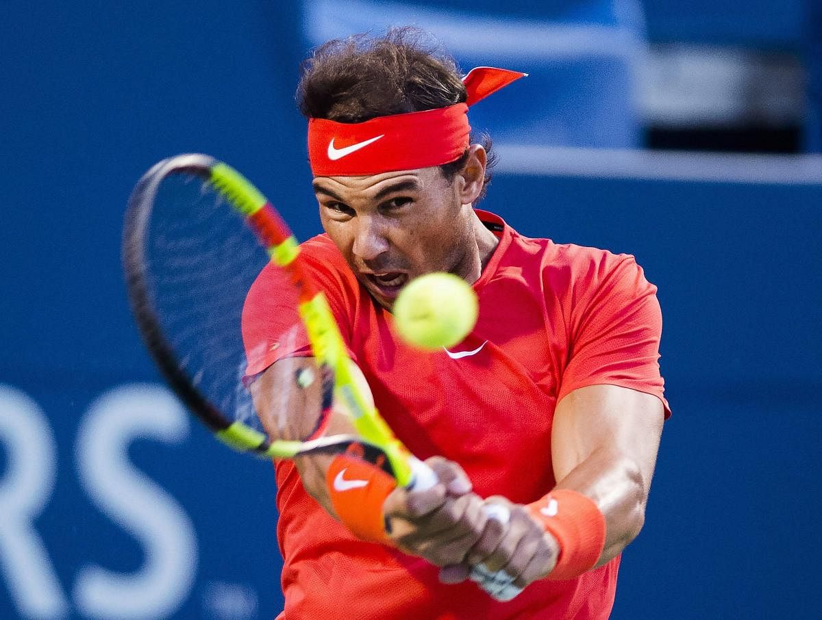Rafael Nadal, of Spain returns during his win over Croatia's Marin Cilic in the quarterfinal of the Rogers Cup. AP/PTI