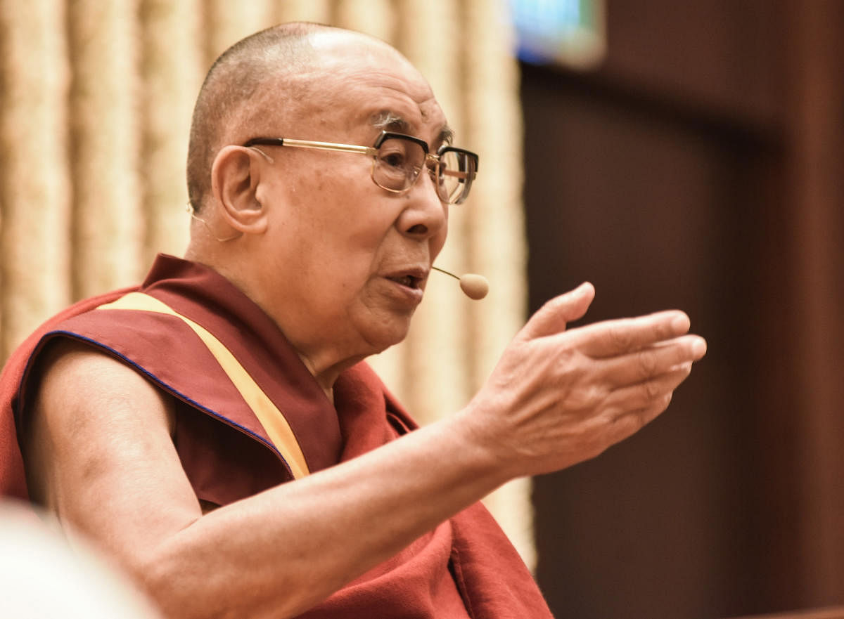 The 14th Dalai Lama speaks at a talk on 'Courage and Compassion in the 21st century', in Bengaluru on Saturday. (DH Photo/S K Dinesh)