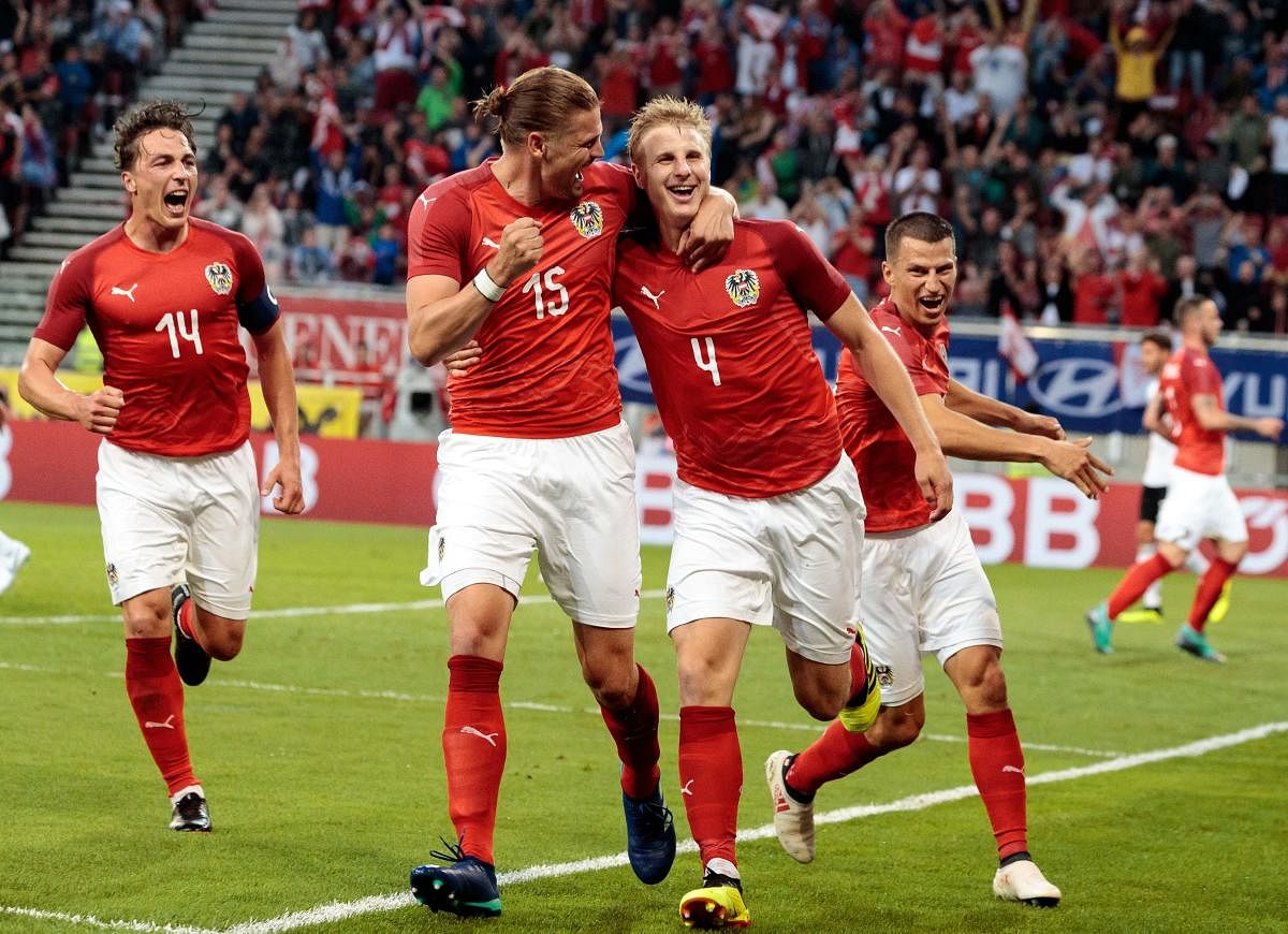 Austria's Martin Hinteregger (right) celebrates with team-mates after scoring against Germany in an international friendly match on Saturday. AFP