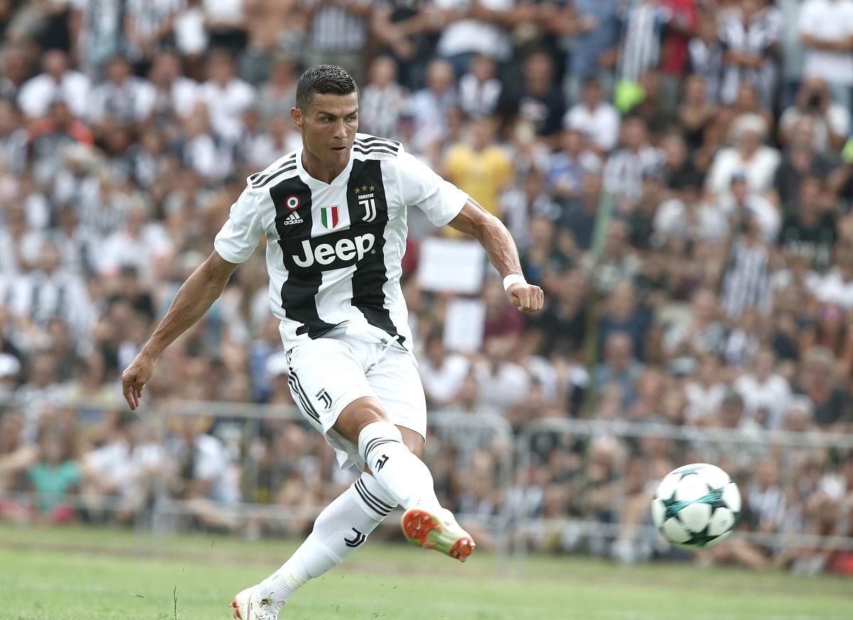 uventus' Cristiano Ronaldo scores during their friendly game against Juventus B at Villar Perosa on Sunday. AFP