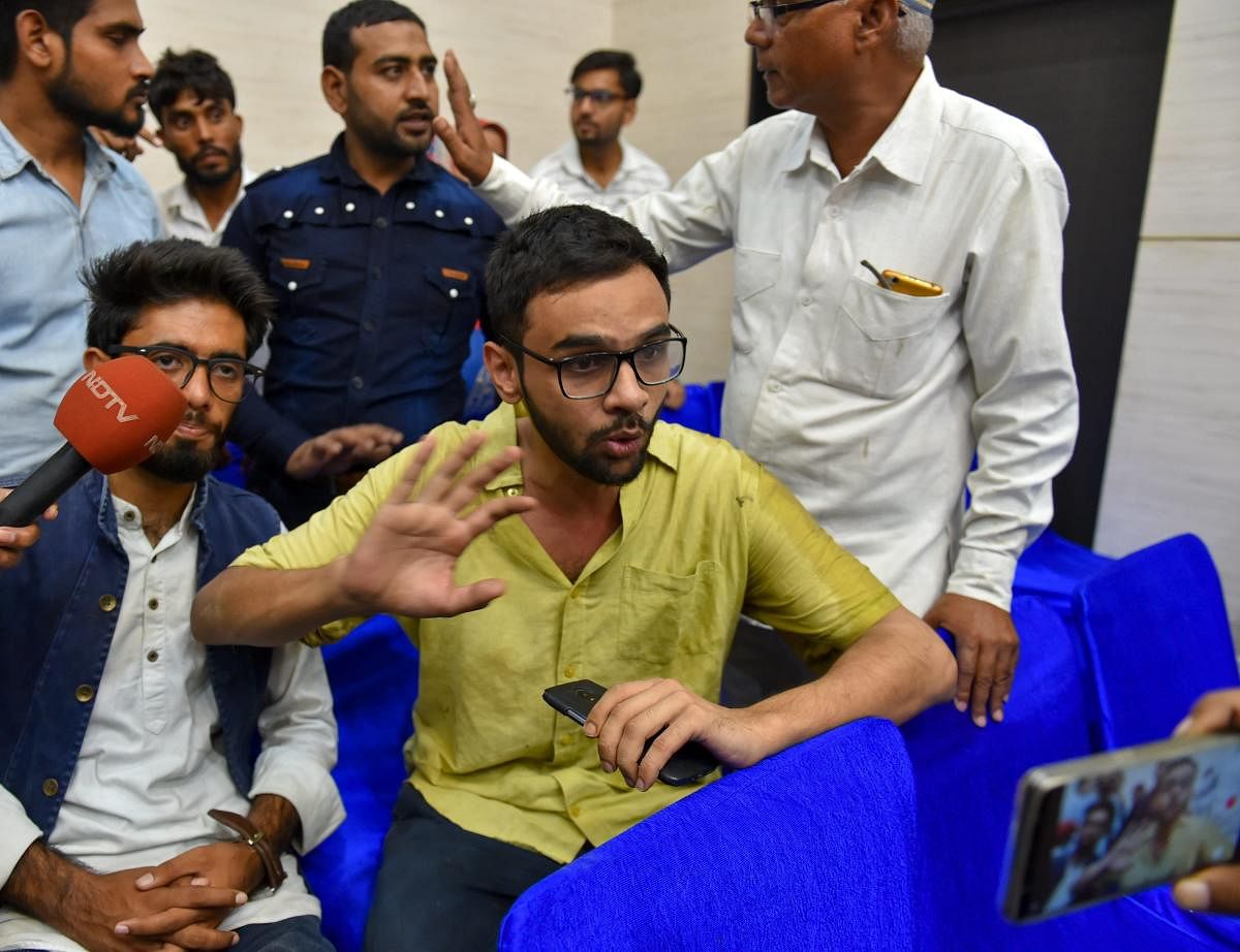 Jawaharlal Nehru University (JNU) student Umar Khalid speaks to the media moments after he was shot at, during an event at the Constitution Club in New Delhi on Monday, Aug 13, 2018. Khalid escaped unhurt. PTI Photo