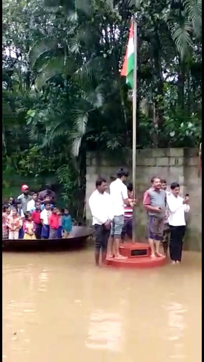 Amid flood, the villagers hoisted the flag using a coracle, at Nelyahudikeri.