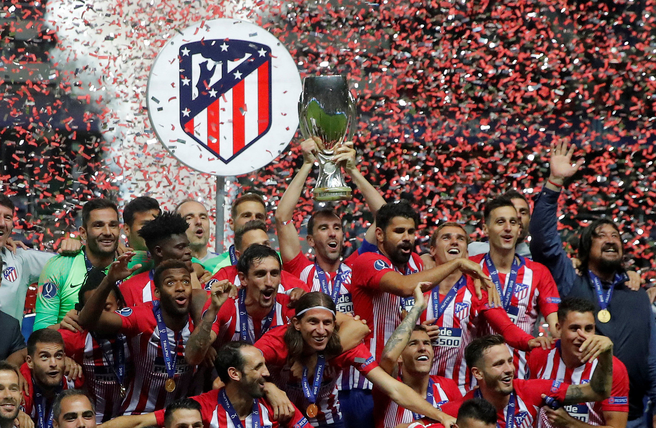 Atletico Madrid's Diego Godin celebrates with UEFA Super Cup trophy. (Reuters)