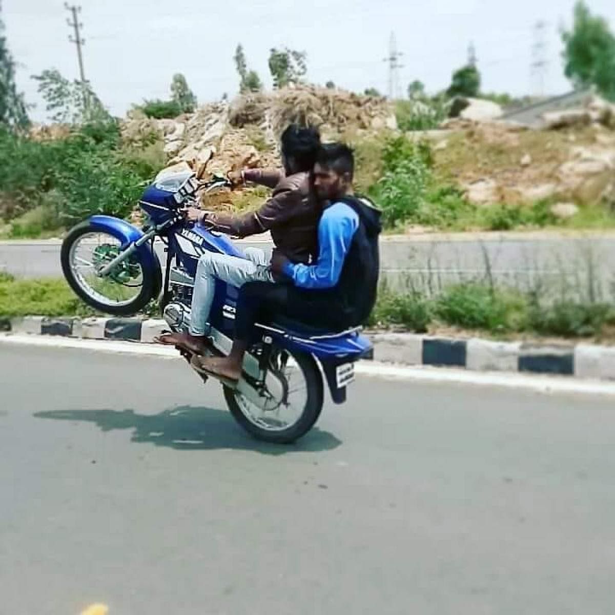 A rider doing a wheelie, as captured by his friend and posted on social media. POLICE HANDOUT