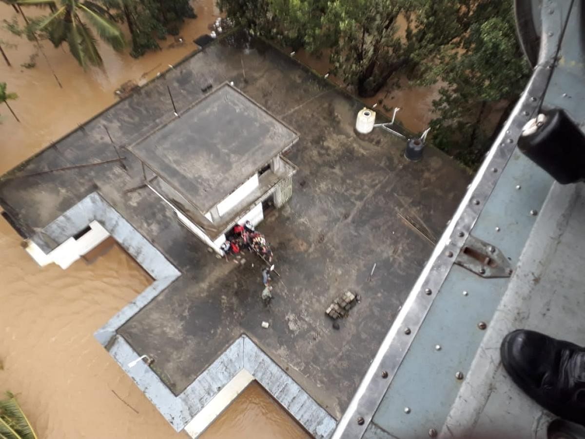 Navy airlift stranded people in Kerala. (ANI Photo)