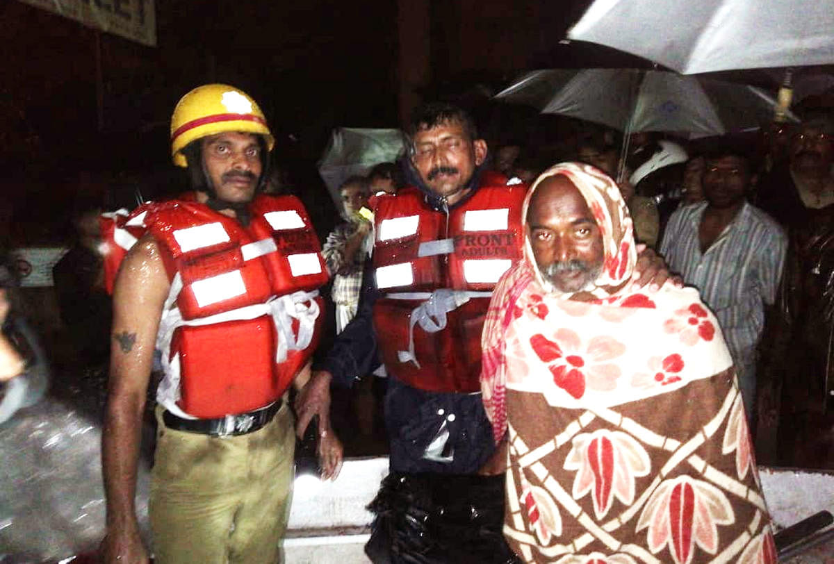 Vinod Mandle from Bihar, who took shelter in a public toilet in Gandhi Maidan, Sringeri, was rescued by the Fire Brigade and ANF staff members.