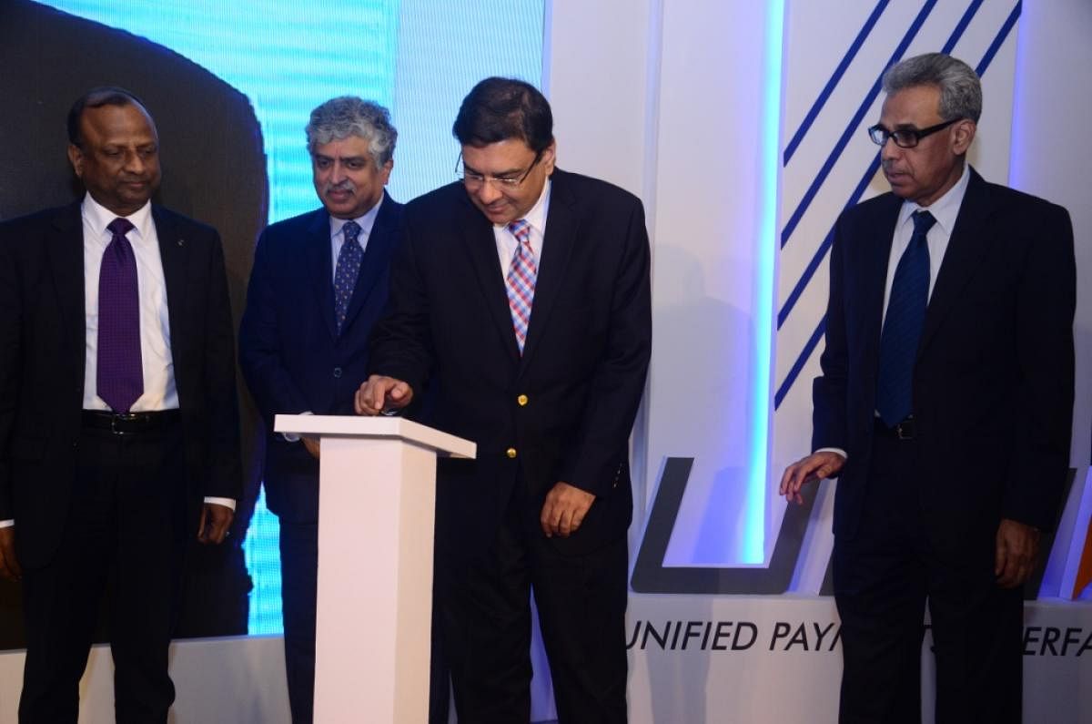 Reserve Bank of India Governor Urjit Patel, NPCI Advisor-Innovation Nandan Nilekani, and SBI Chairman Rajnish Kumar are seen at the launch of UPI 2.0.