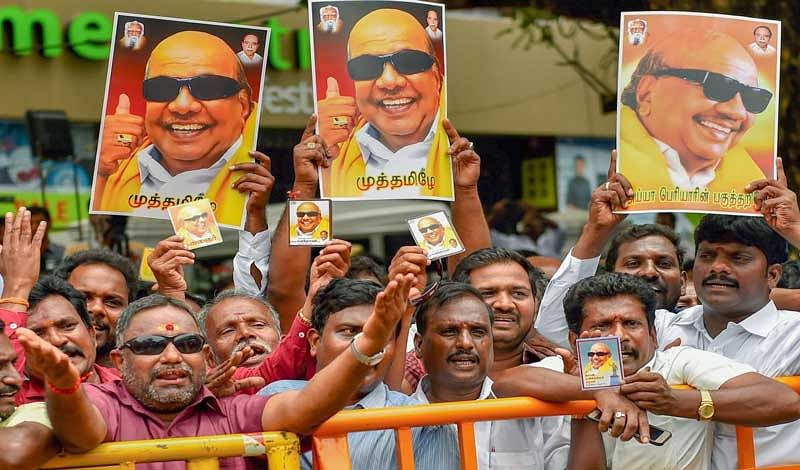 DMK supporters gather near the Kauvery Hospital where DMK President M Karunanidhi in undergoing treatment, in Chennai on Tuesday, Aug 7, 2018. Supporters have started thronging the hospital after Karunanidhi's conditions, reportedly, deteriorated on Monday. (PTI Photo)