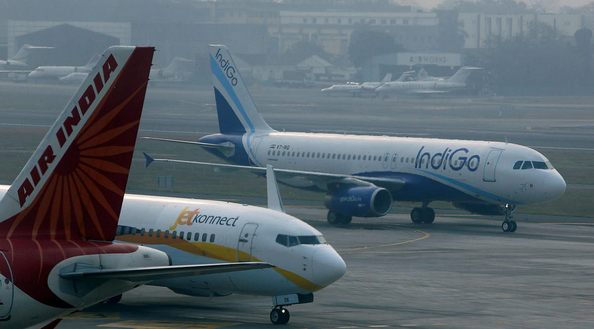 An IndiGo Airlines Airbust A320 aircraft and JetKonnect Boeing 737 aircraft taxi past an Air India Airbus A321 aircraft at Mumbai's Chhatrapathi Shivaji International Airport. REUTERS