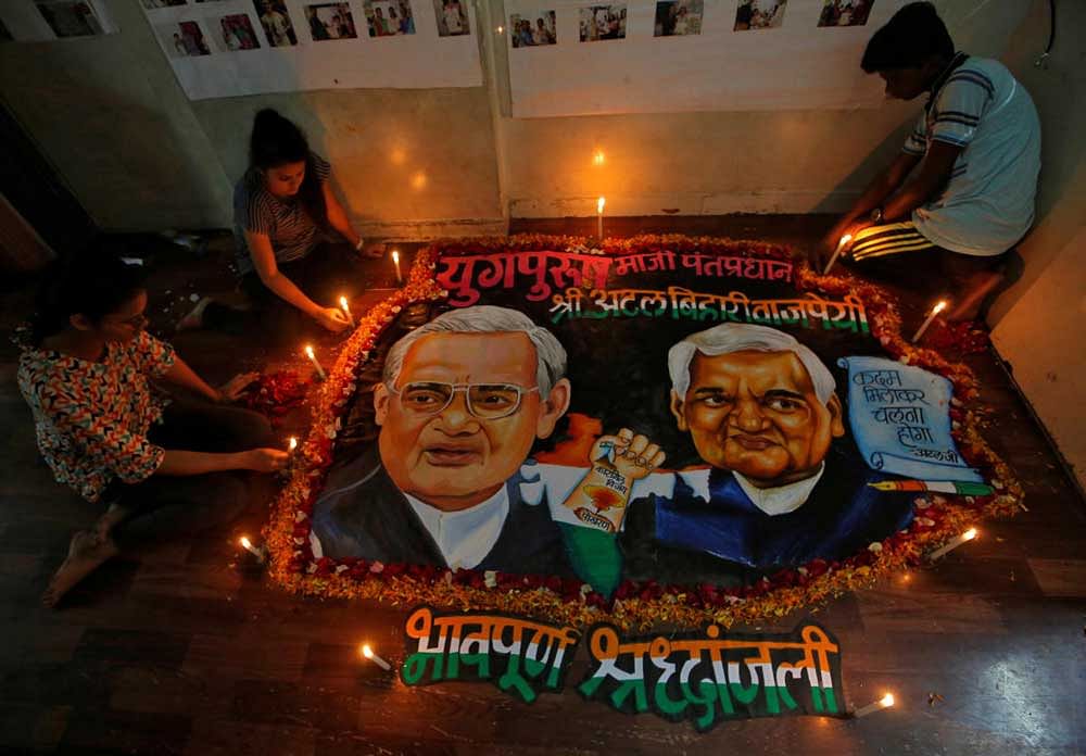 Students place candles around a painting featuring former prime minister Atal Bihari Vajpayee to pay him homage in Mumbai. Reuters Photo