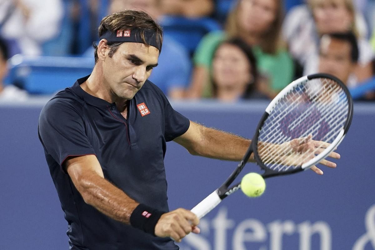 Roger Federer returns to Stan Wawrinka during the quarterfinals of the Western & Southern Open tennis tournament on Friday. (AP/PTI Photo)