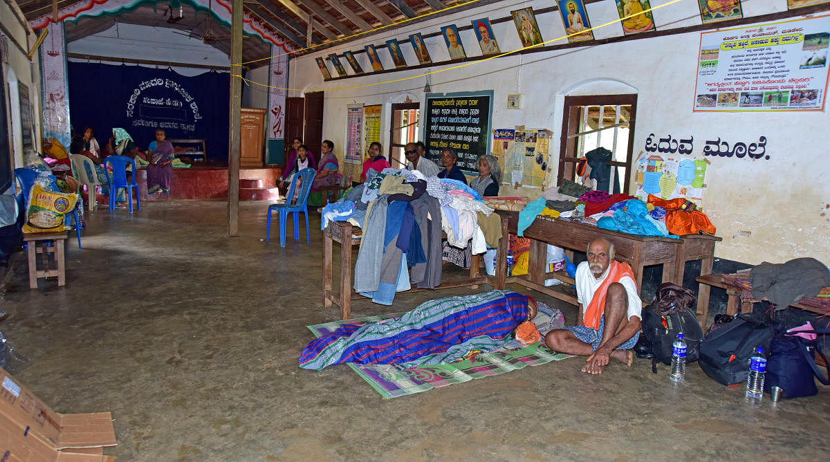 Rain victims at a gruel centre opened at the Government Higher Primary School, at Sampaje in Dakshina Kannada.