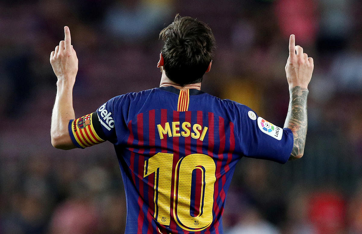 Barcelona's Lionel Messi celebrates scoring their third goal against Alaves. (Reuters Photo)