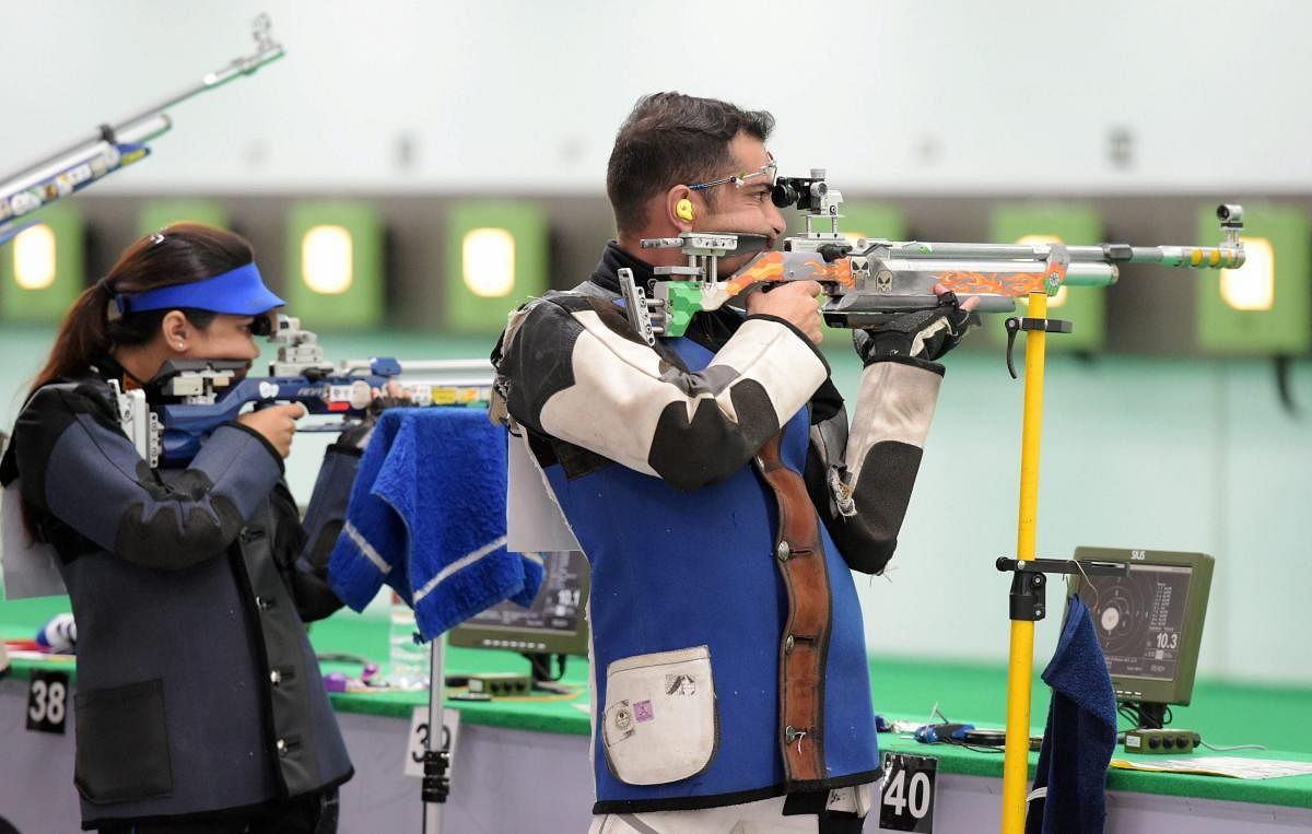 Indian shooters Ravi Kumar and Apurvi Chandela compete in the qualification 10m Air Rifle Mix Team event during the 18th Asian Games Jakarta Palembang, in Indonesia on Sunday. (PTI Photo)
