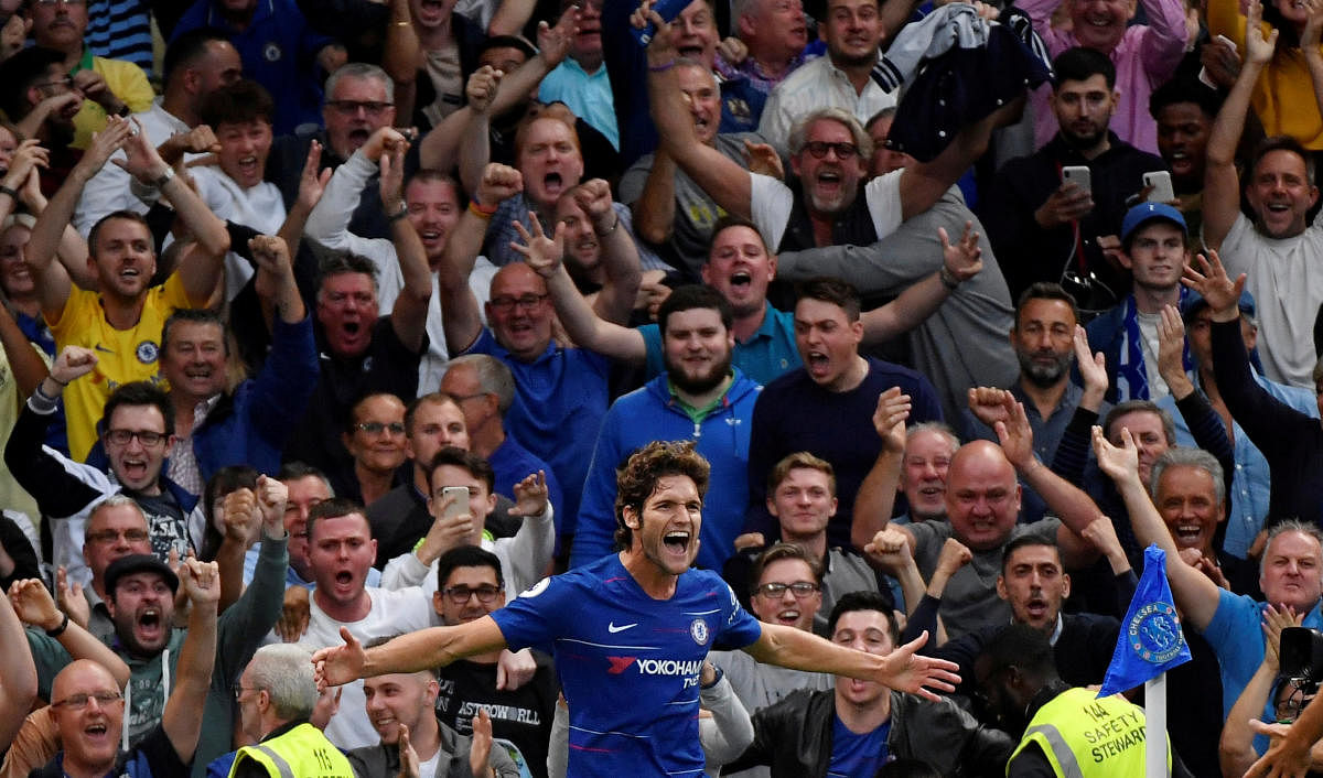 SEALED THE DEAL Chelsea's Marcos Alonso (centre) celebrates scoring his side's third goal. REUTERS