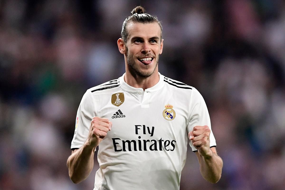 FINE SHOW: Real Madrid's forward Gareth Bale celebrates after scoring a goal against Getafe during their La Liga tie on Sunday. AFP