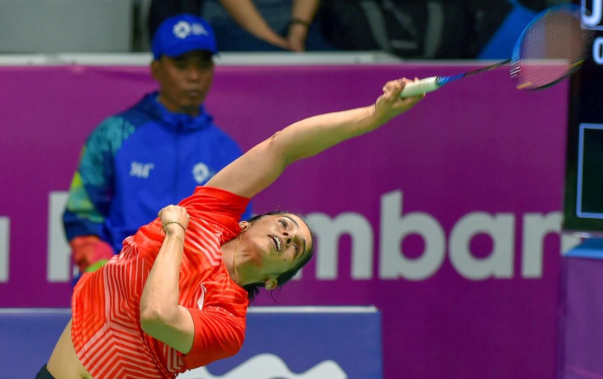 Indian shuttler Saina Nehwal in action against Japan player Nozomi Okuhara (unseen) at Women's Team quarterfinals event during the 18th Asian Games Jakarta Palembang 2018, in Indonesia on Monday, Aug 20, 2018. (PTI Photo)