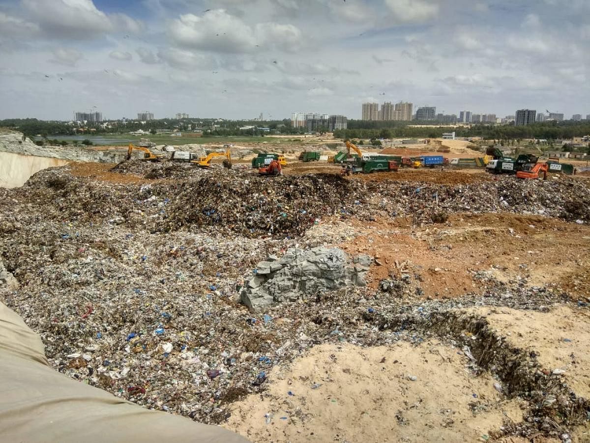 The abandoned quarry in Bellahalli is being filled with mixed waste in violation of NGT orders.