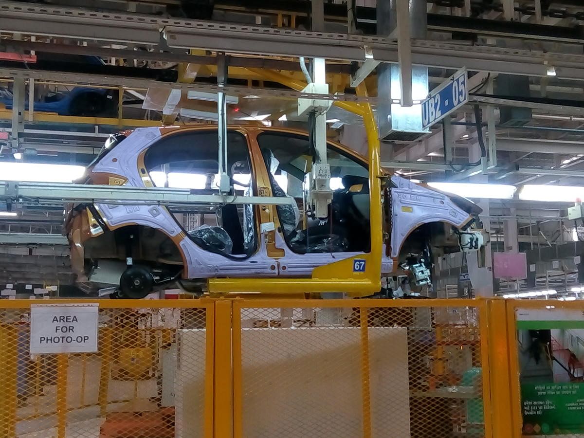 A car being assembled at the Sanand plant. DH Photo by Uma Kannan