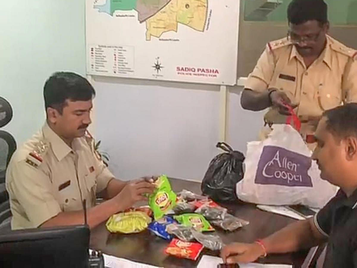 Police seizing 2 kg of ganja concealed in Lays and Kurkure packets on Tuesday evening.