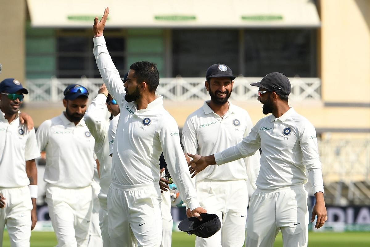 India's captain Virat Kohli (centre) waves to the crowd after winning the third Test against England on Wednesday. AFP