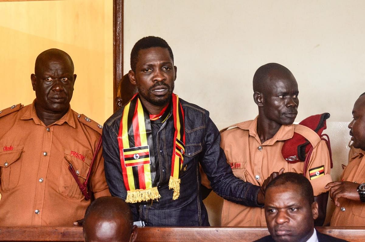 Uganda's prominent opposition politician Robert Kyagulanyi known as Bobi Wine appears at the chief magistrate court in Gulu, northern Uganda, on August 23, 2018. AFP