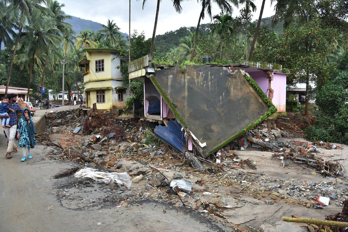 A view of the houses that were severely damaged in flash floods at Kannappanakundu,Kozhikode district in Kerala, on Wednesday. DH PHOTO BY JANARDHAN B K