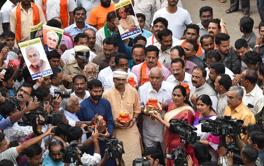 BJP state president B S Yeddyurappa brought the urns containing the ashes of Vajpayee from New Delhi. Top state leaders including Ananth Kumar, D V Sadananda Gowda and R Ashoka were present. DH Photo