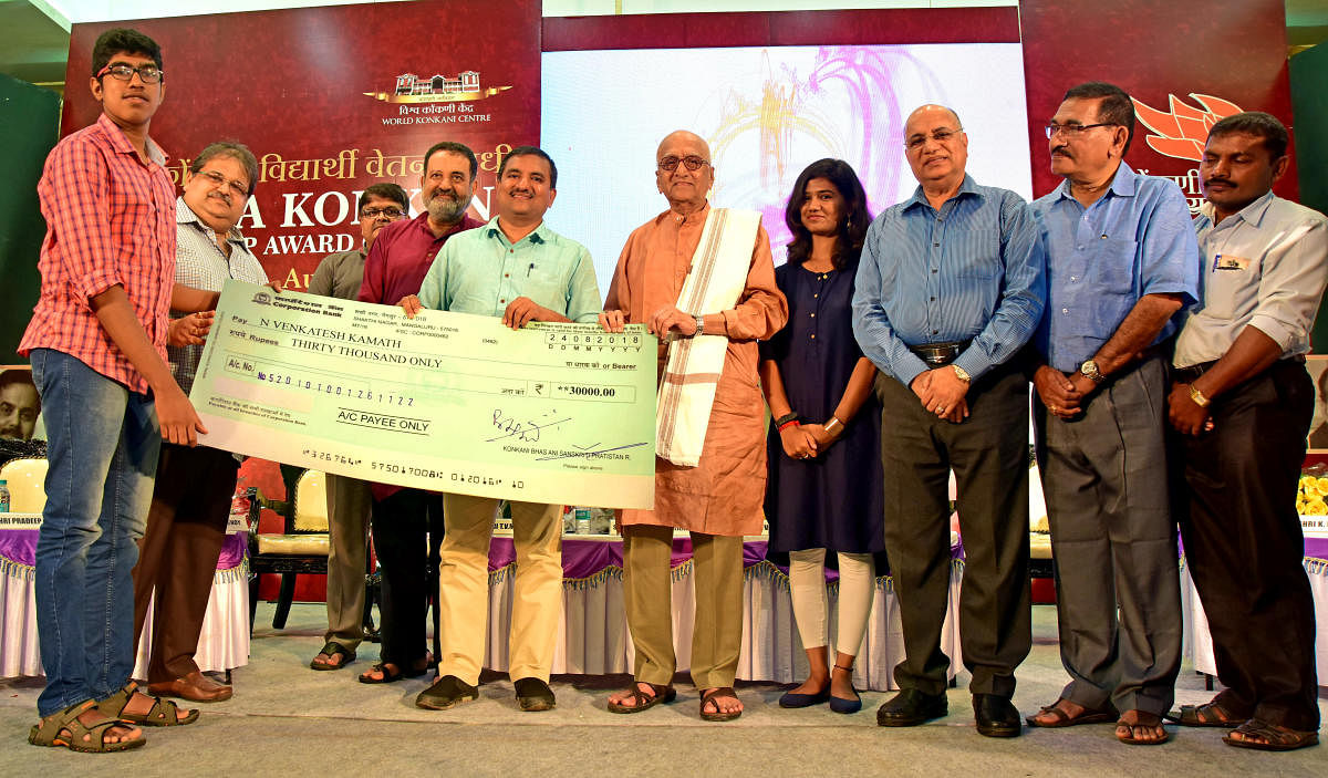 Engineering student N Venkatesh Kamath receives scholarship, instituted by Vishwa Konkani Student Scholarship Fund (VKSSF), at a programme in Mangaluru on Friday.