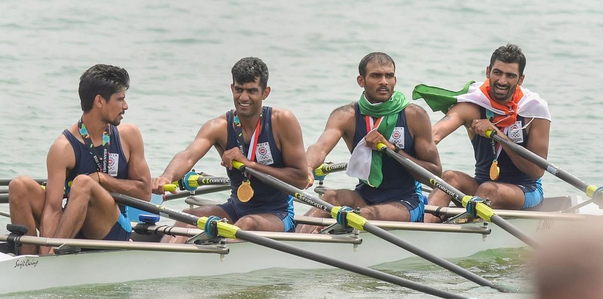 ECSTATIC: Sawarn Singh, Bhokanal Dattu, Om Prakash and Sukhmeet Singh (from left) celebrate after winning the quadruple sculls gold at the Asian Games on Friday. PTI