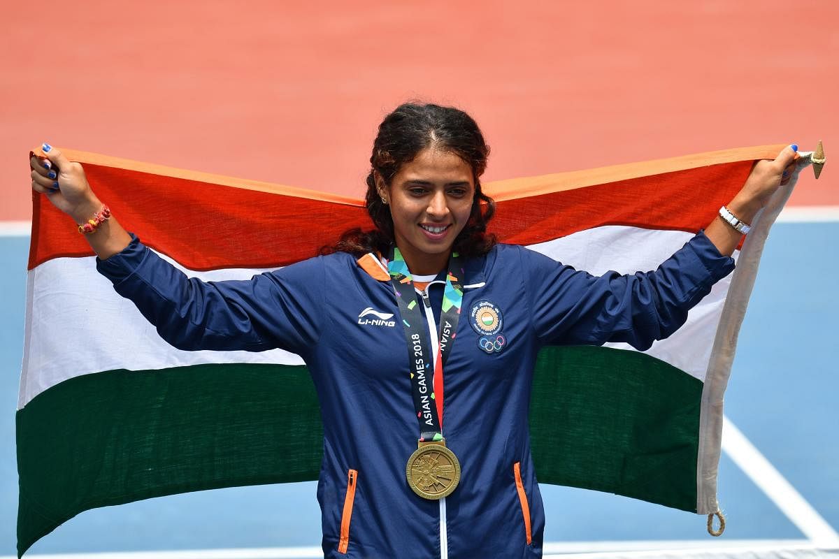 Indian tennis player Ankita Raina celebrates after winning bronze in the women's singles event. AFP