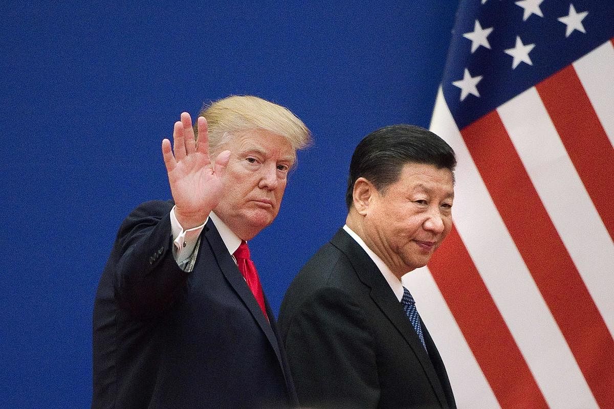 US President Donald Trump and China's President Xi Jinping at the Great Hall of the People in Beijing on November 9, 2017. AFP