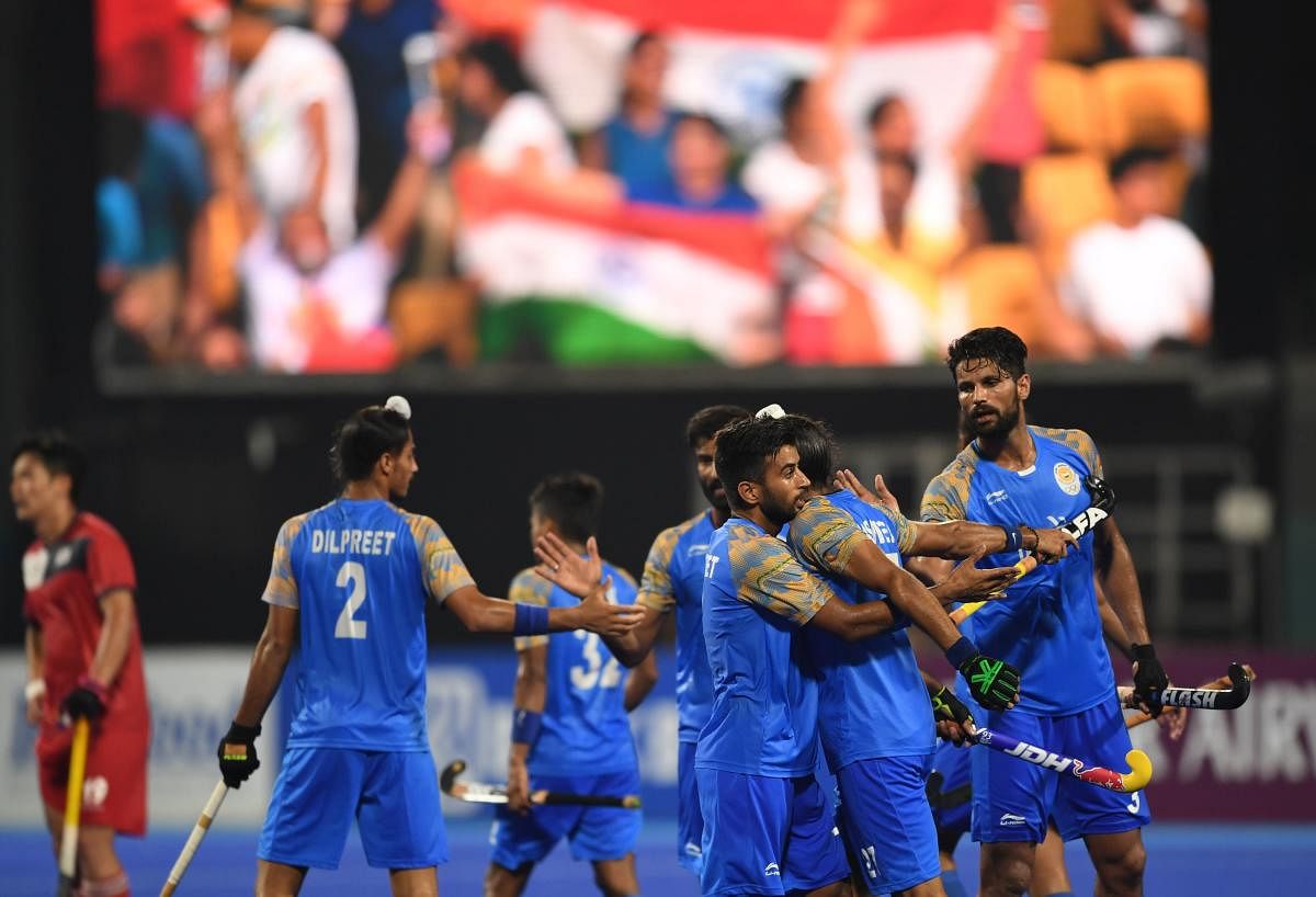 India's players celebrate after scoring a goal against South Korea during the men's hockey pool A match between India and South Korea at the 2018 Asian Games in Jakarta on August 26, 2018. AFP
