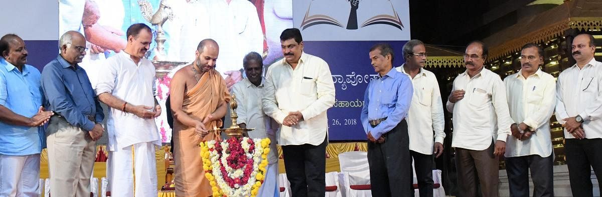 Admaru Mutt junior seer Eshapriya Swami inaugurates a programme organised to give away Vidyaposhak scholarships to the meritorious students in Udupi on Sunday.