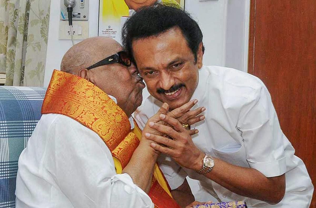 The then DMK working president M K Stalin with his father and party president M Karunanidhi. (PTI File Photo)